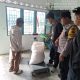 Bhabinkamtibmas Polsek Siantar Marihat Dampingi Petani Jual Hasil Panen Jagung ke Bulog